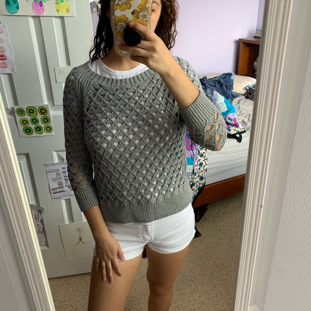 Grey sweater with geometric cutouts